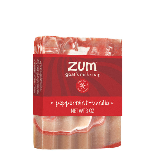 A bar of Zum goat's milk soap in the peppermint-vanilla scent, featuring a red paper label with white text, set against a plain white background.
