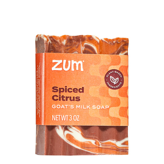 Zum spiced citrus goat's milk soap bar with orange and brown packaging on a white background