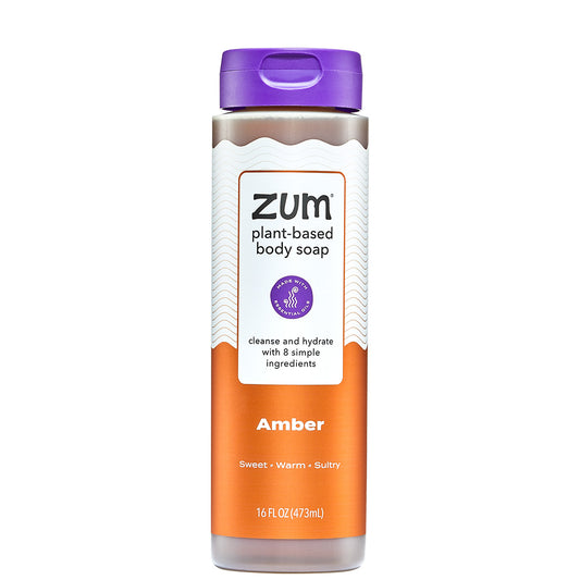 Zum plant-based body soap bottle with purple cap and orange label on a white background