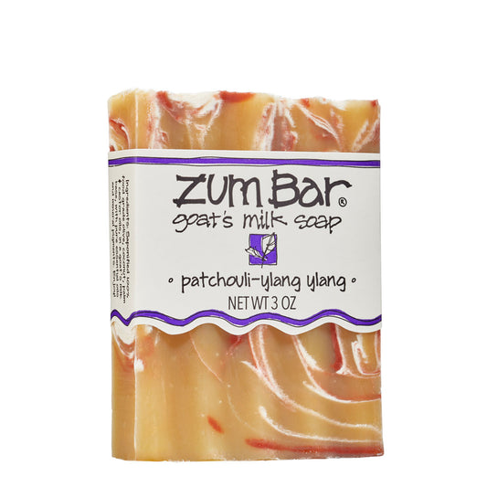 Labeled patchouli-ylang ylang scented Zum Bar Soap with brown, white and red colored swirls