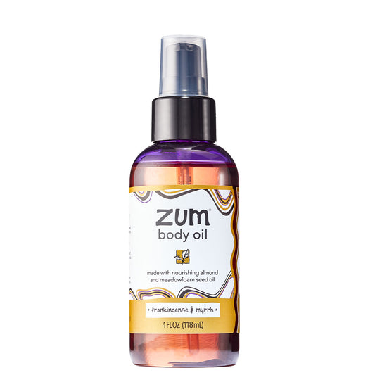 Cylinder bottle with pump top and cap containing Franincense & Myrrh scented massage and body oil.