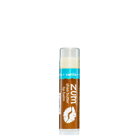 0.15 tube stick of Zumbo Kiss shea butter lip balm in the flavor Vanilla. Label colors are brown and blue.