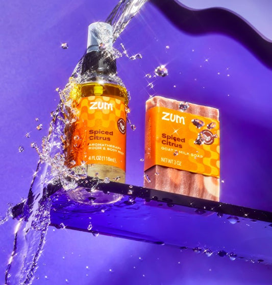 Zum Spiced Citrus product with water splash on a purple background