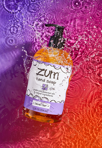 Frankincense & Myrrh and Lavender Zum Hand Soap on a pink/purple gradient background.