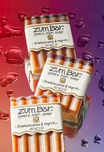 Sudsy Zum Bar on purple shelf with purple tile background.