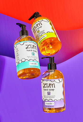 Frankincense & Myrrh and Lavender Zum Hand Soap on a pink/purple gradient background.