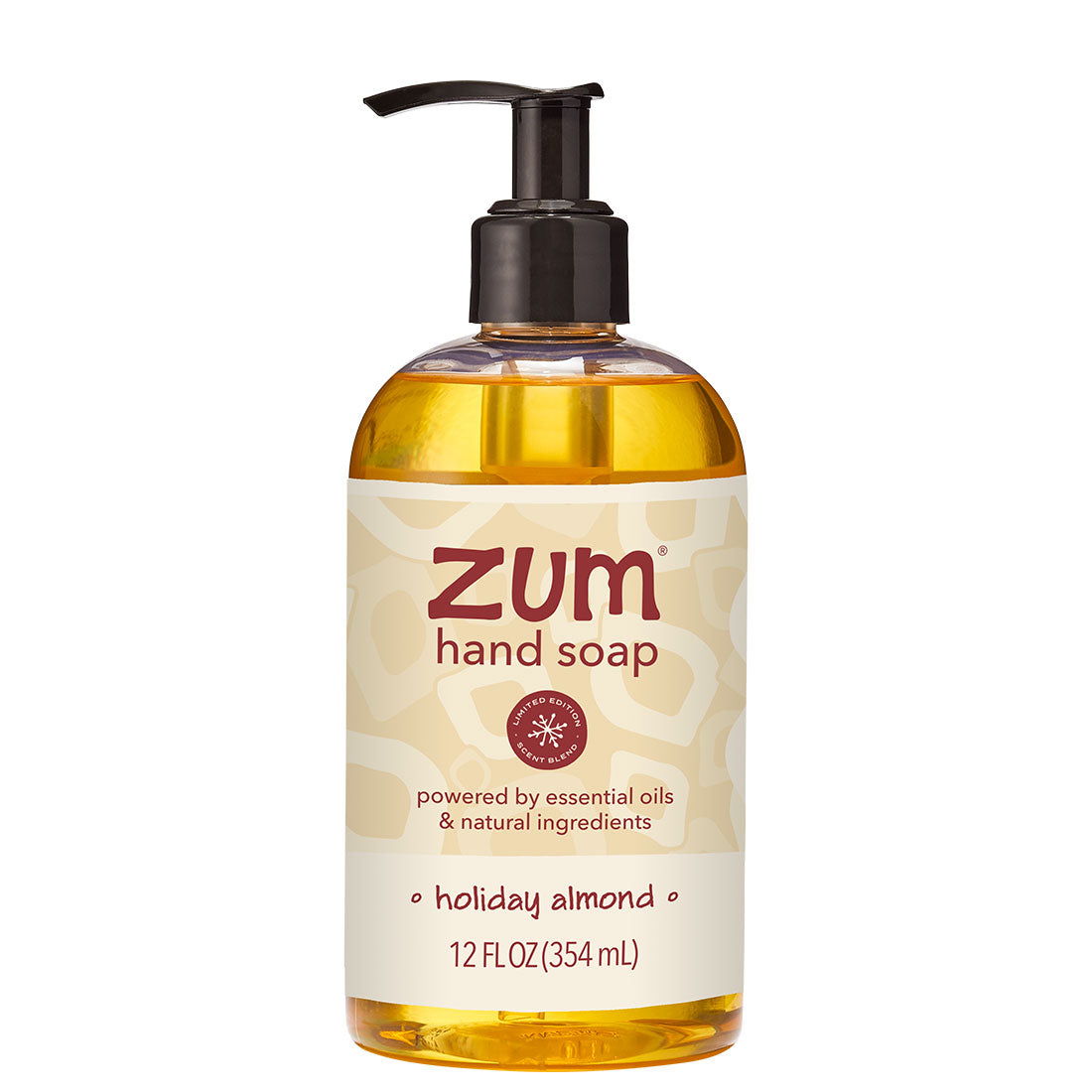 A 12 fl oz bottle of Zum Hand Soap in the Holiday Almond scent, featuring a clear bottle filled with golden-yellow liquid, a black pump dispenser, and a cream-colored label with red and brown text.