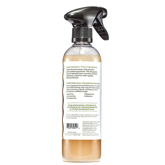 Clear spray bottle with a label on a white background
