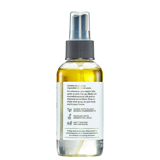 Clear spray bottle with label on a white background