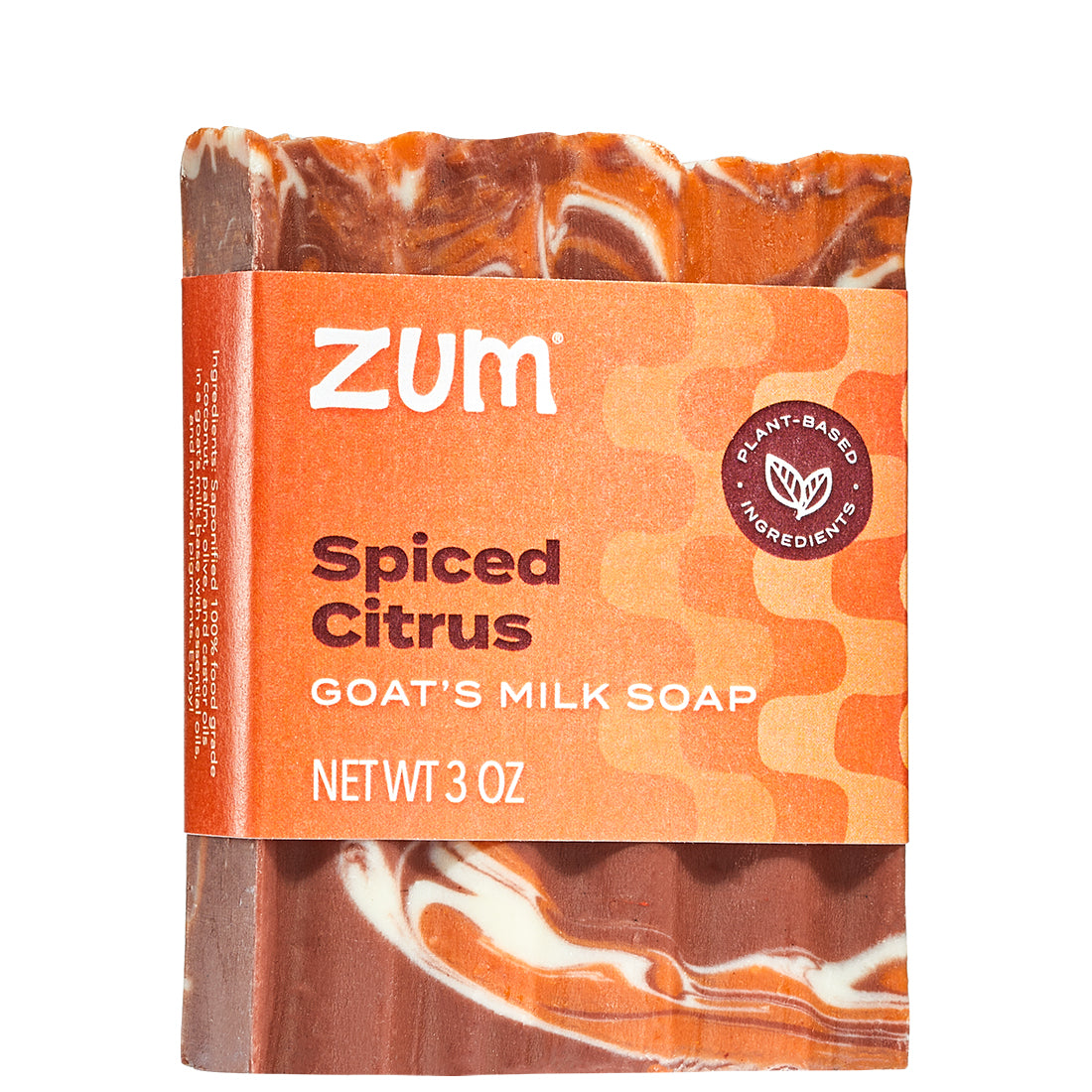 Zum spiced citrus goat's milk soap bar with orange and brown packaging on a white background