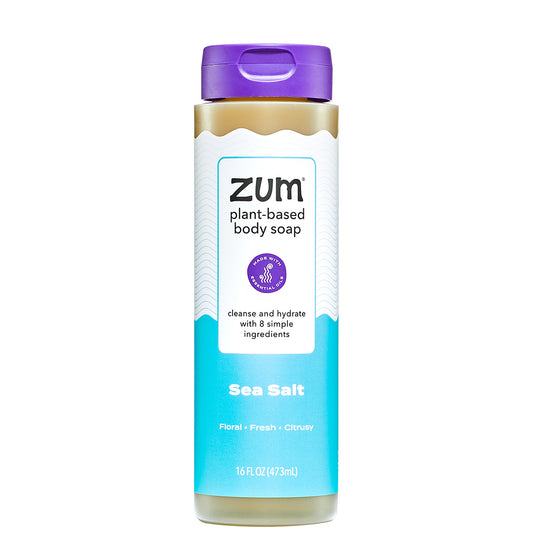 Zum plant-based body soap bottle with purple cap and label on a white background