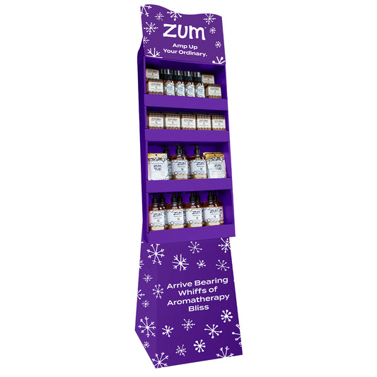 A purple holiday Zum display filled with Frankincense & Myrrh products
