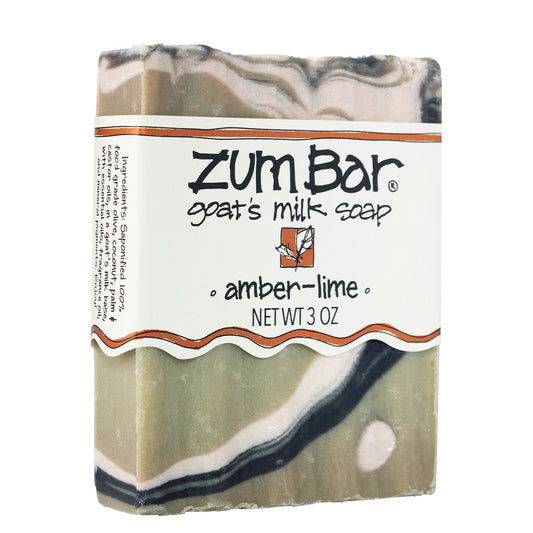 Green, white, and black swirled soap bar with white label.