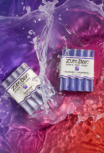 Sudsy Zum Bar on purple shelf with purple tile background.