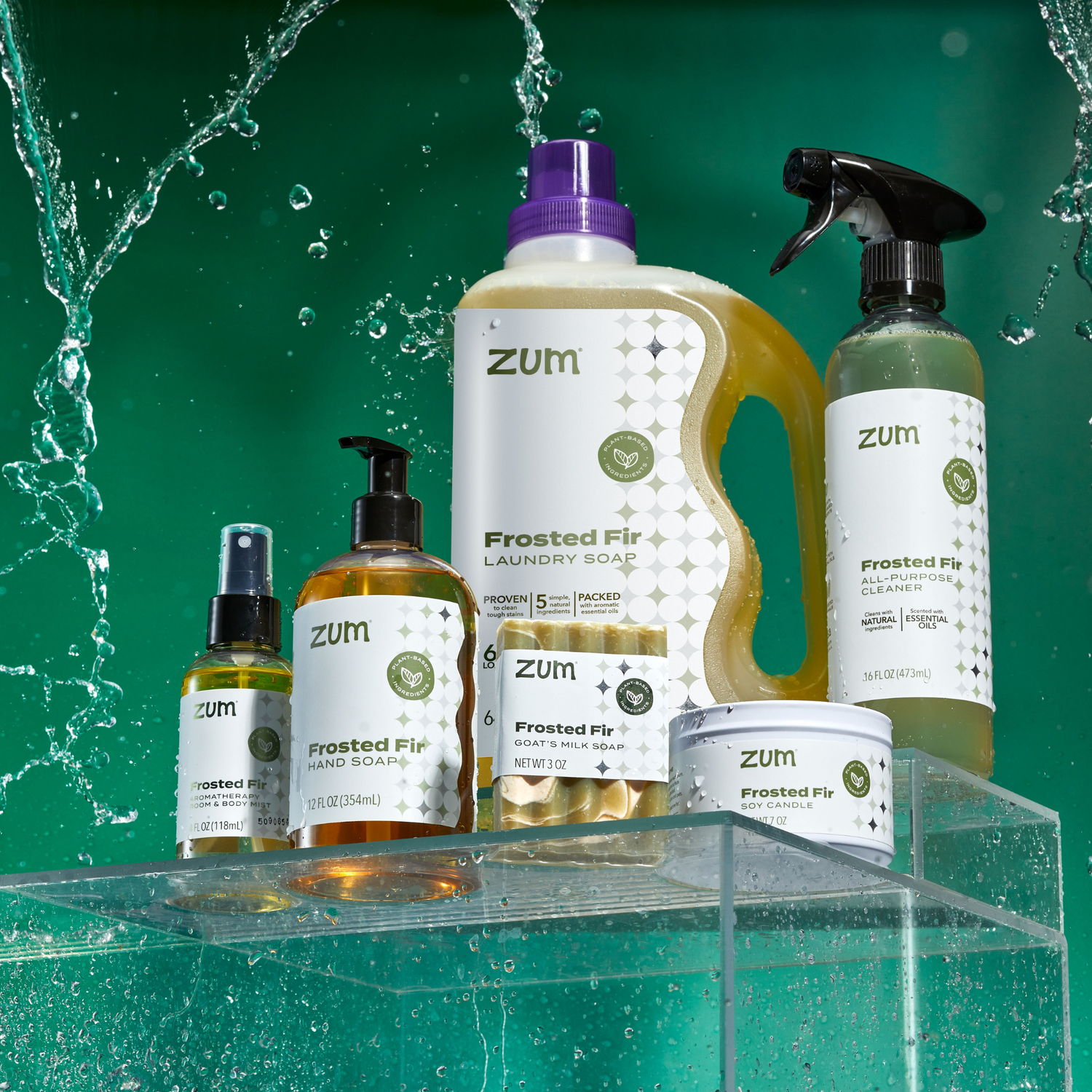 Zum laundry soap and cleaning products on a clear stand with water droplets.